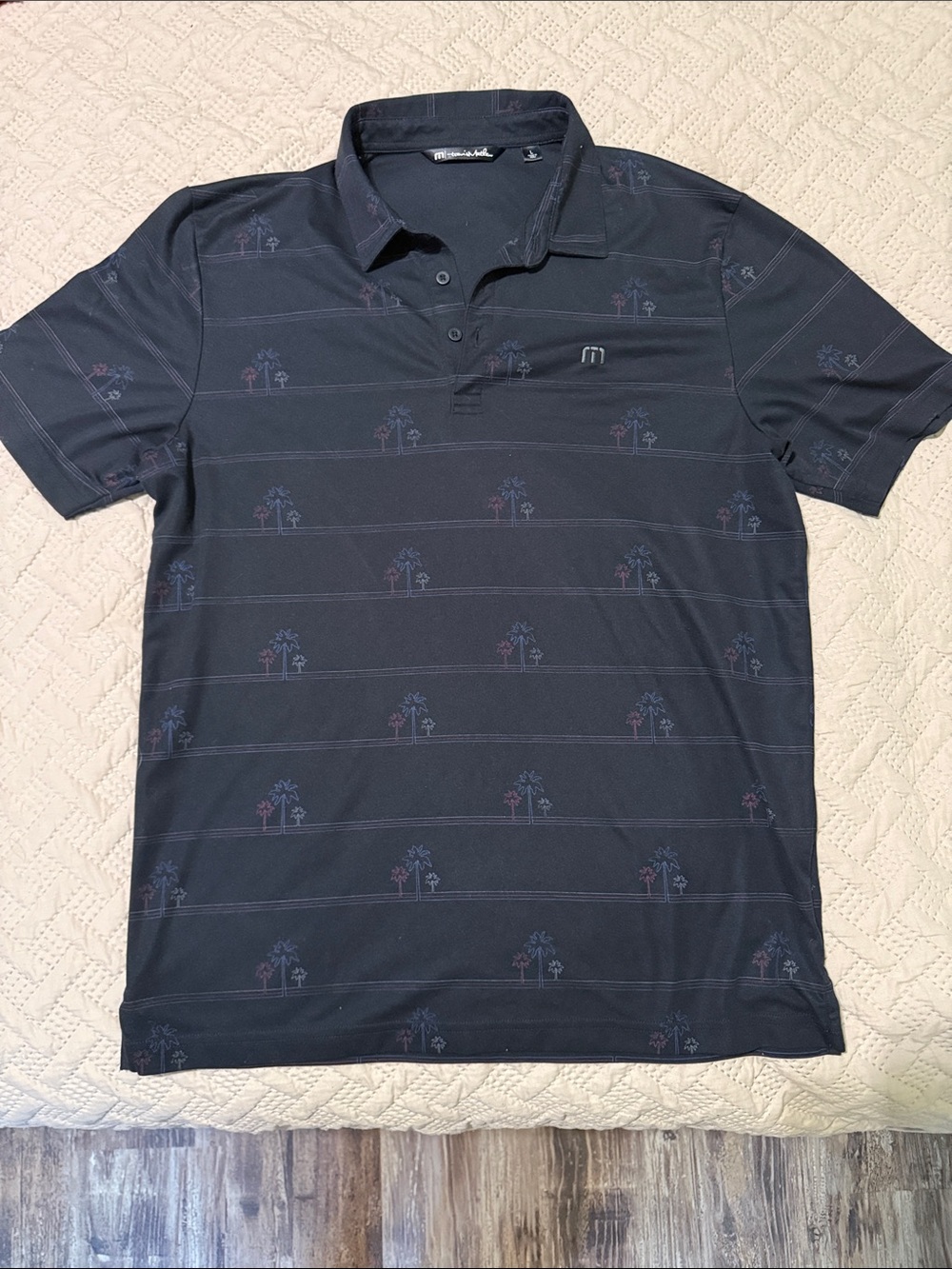 Travis Mathew Navy Polo with Subtle Palm Motif